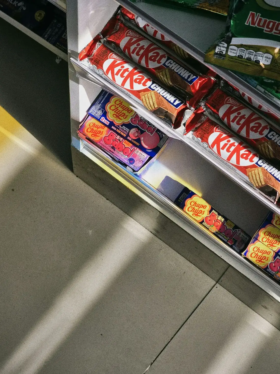 Candy bars and gum on a retail shelf